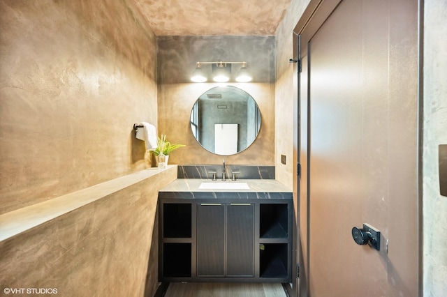 bathroom with hardwood / wood-style flooring and vanity