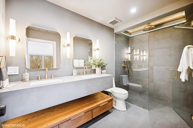 bathroom with toilet, an enclosed shower, and vanity