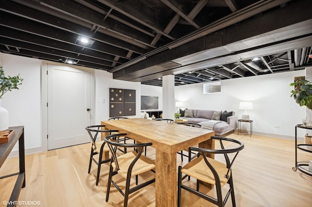 dining area with light wood-type flooring