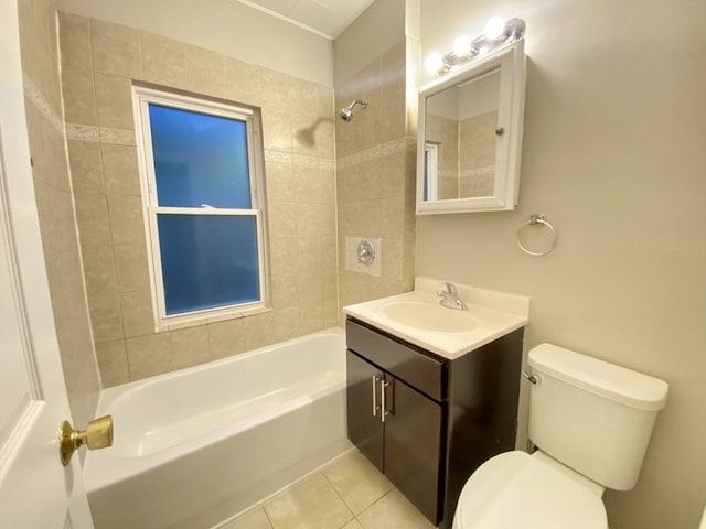 full bathroom with tiled shower / bath, tile patterned flooring, vanity, and toilet