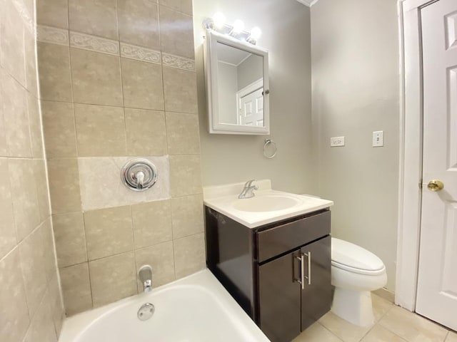 bathroom with toilet, tile patterned floors, and vanity