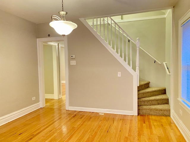 stairway featuring hardwood / wood-style flooring