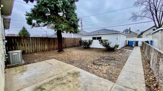 view of yard with a patio and central AC unit