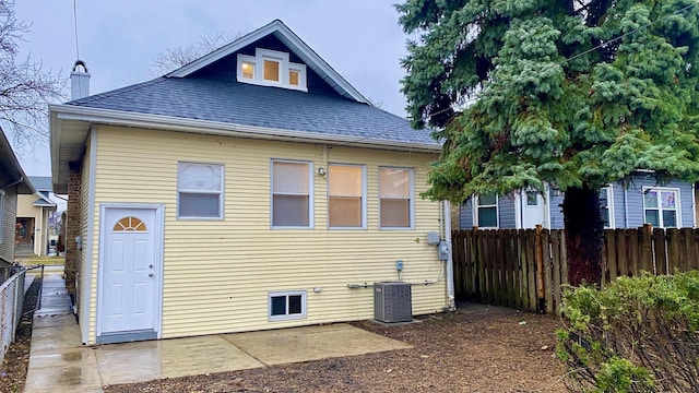 back of property with a patio area and central AC unit