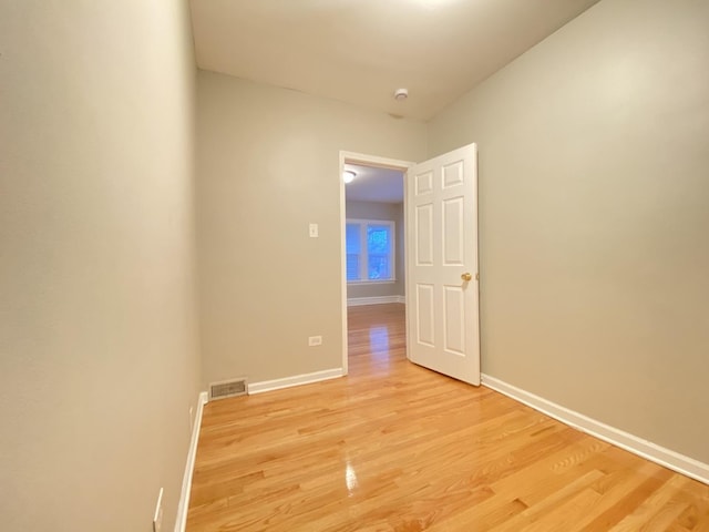 unfurnished room featuring light hardwood / wood-style floors