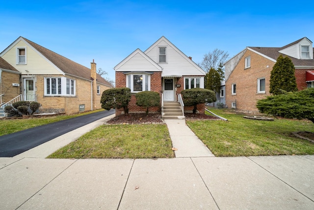 bungalow-style house featuring a front yard