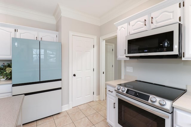 kitchen featuring ornamental molding, stainless steel range with electric stovetop, white cabinets, and light tile patterned floors