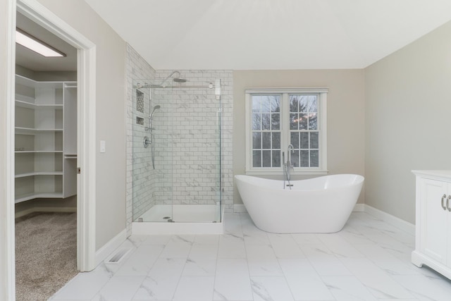 bathroom featuring separate shower and tub and vaulted ceiling