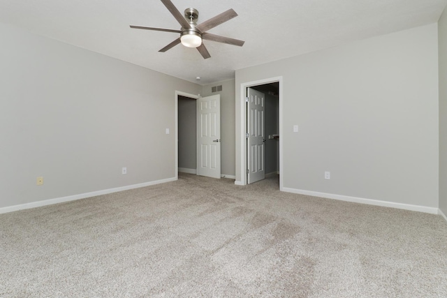 unfurnished bedroom with ceiling fan and carpet flooring