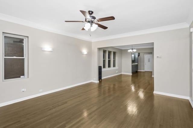 unfurnished living room with crown molding, dark wood-type flooring, and ceiling fan with notable chandelier