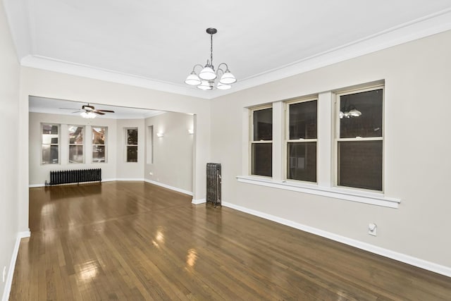 unfurnished living room featuring ceiling fan with notable chandelier, dark hardwood / wood-style floors, radiator heating unit, and crown molding