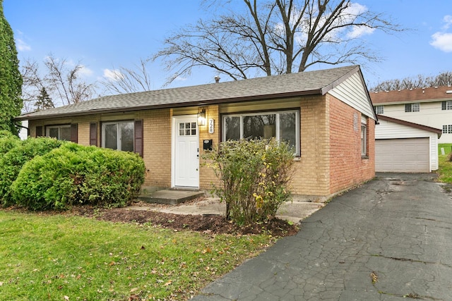 view of front of home featuring an outbuilding and a garage