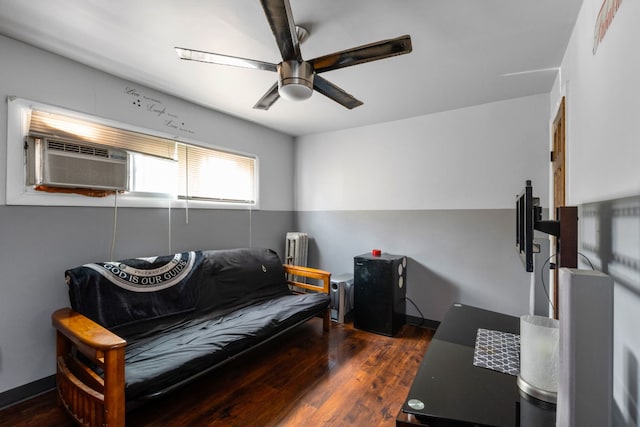 living room with ceiling fan, radiator heating unit, and dark wood-type flooring