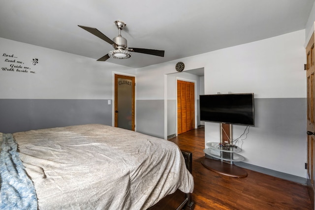 bedroom with a closet, ceiling fan, and dark hardwood / wood-style floors