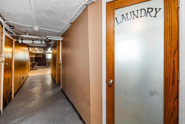 hall with a textured ceiling