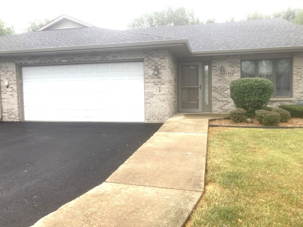 single story home featuring a garage