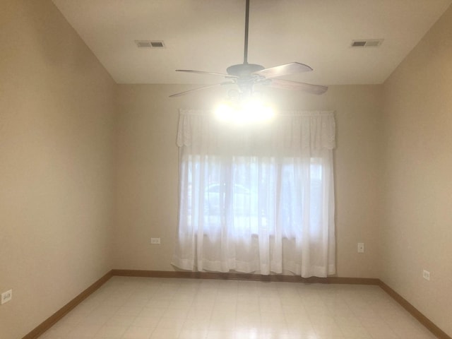 unfurnished room with ceiling fan