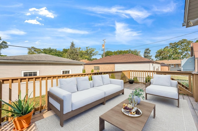 wooden terrace with an outdoor hangout area