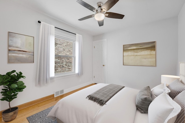 bedroom featuring ceiling fan and hardwood / wood-style floors