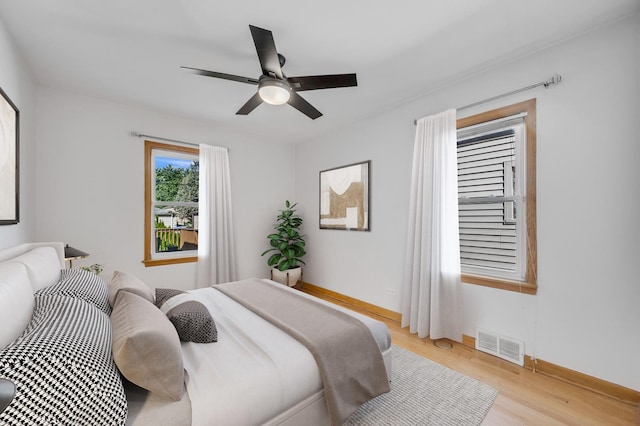 bedroom featuring light hardwood / wood-style floors and ceiling fan