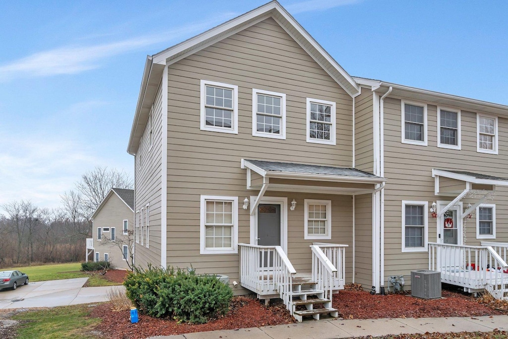 view of front of home featuring central air condition unit