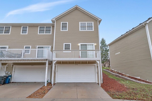 rear view of property featuring a garage