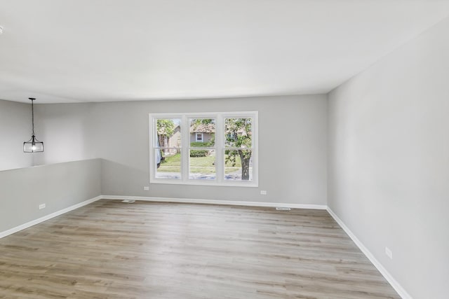 unfurnished room featuring light hardwood / wood-style flooring