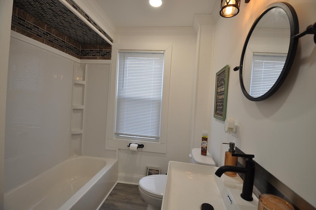 full bathroom with toilet, crown molding, hardwood / wood-style flooring, and sink