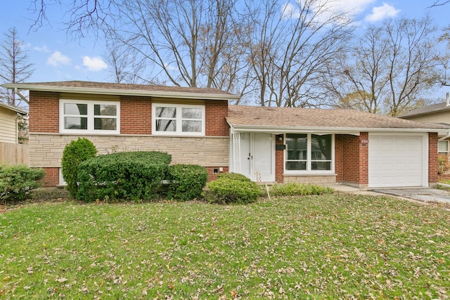 tri-level home with a front yard and a garage