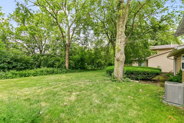 view of yard featuring central AC unit