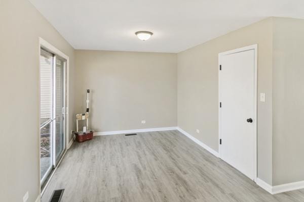 spare room with light hardwood / wood-style floors