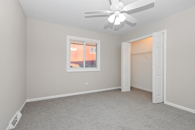 unfurnished bedroom featuring ceiling fan, a closet, and carpet floors