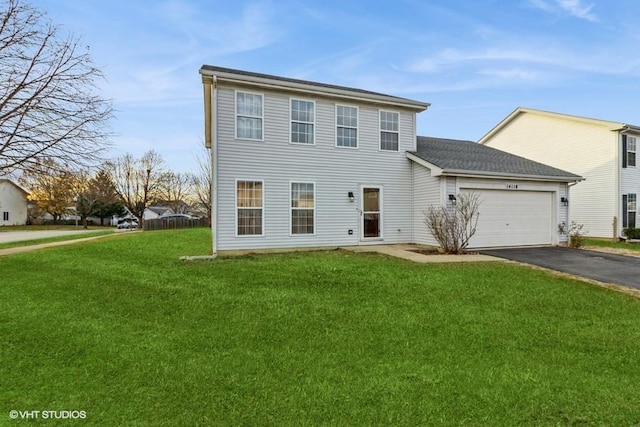 view of front facade featuring a garage and a front yard