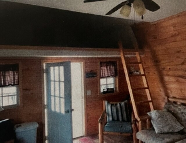 990 E 2800 N Rd, Clifton, IL 60927 - sitting room featuring wooden walls and ceiling fan