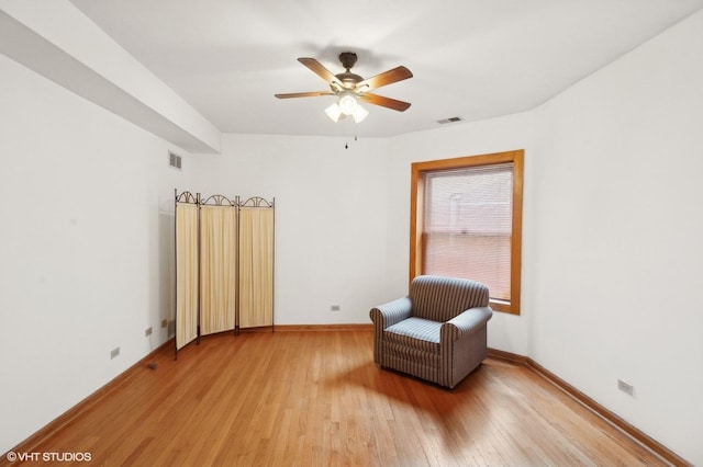 sitting room featuring ceiling fan and light hardwood / wood-style flooring