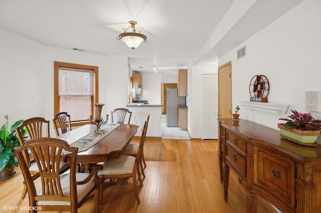 dining space featuring light hardwood / wood-style floors