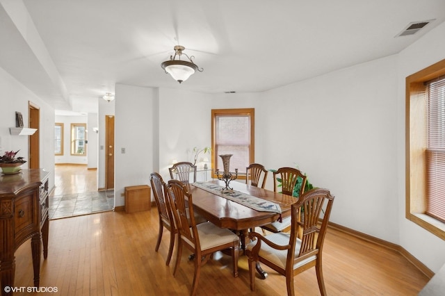 dining room featuring light hardwood / wood-style flooring