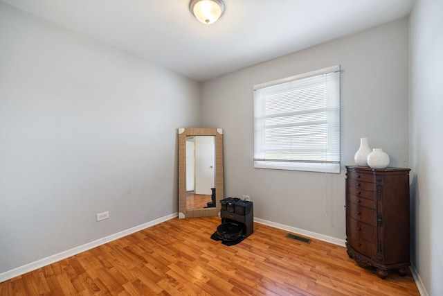 unfurnished room with light hardwood / wood-style floors