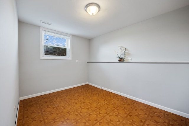 spare room with parquet floors