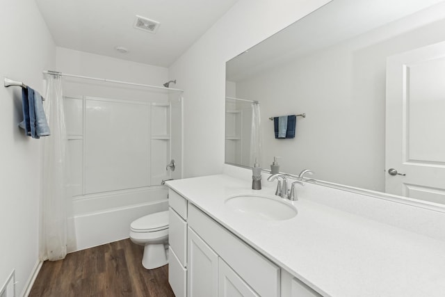 full bathroom with toilet, shower / tub combo with curtain, vanity, and hardwood / wood-style flooring