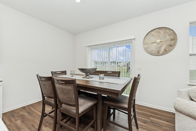 dining area featuring dark hardwood / wood-style floors