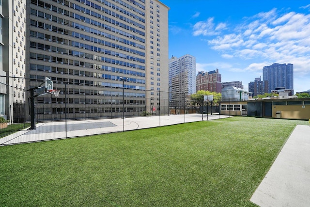 exterior space featuring basketball hoop