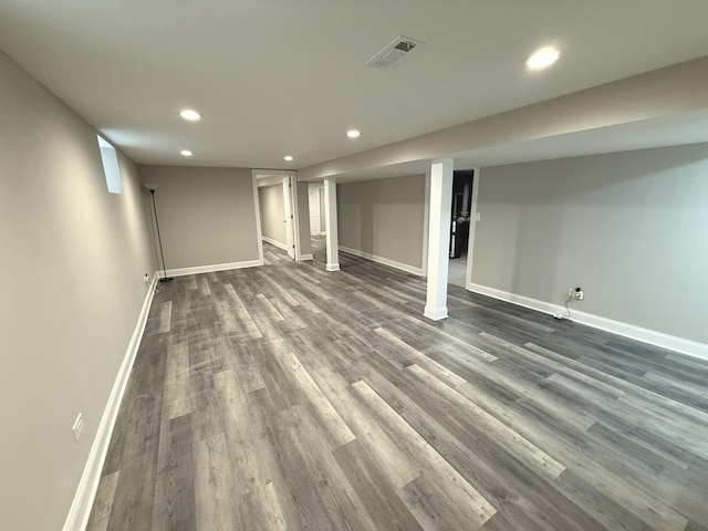 basement with dark wood-type flooring