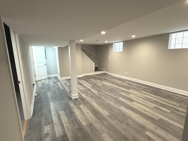 basement featuring dark hardwood / wood-style flooring