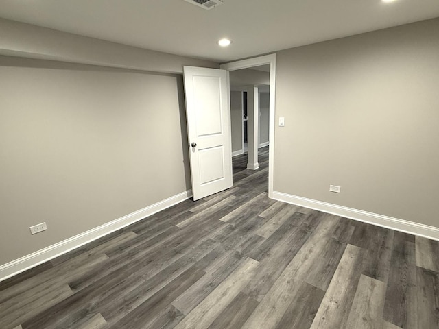 spare room with dark hardwood / wood-style floors