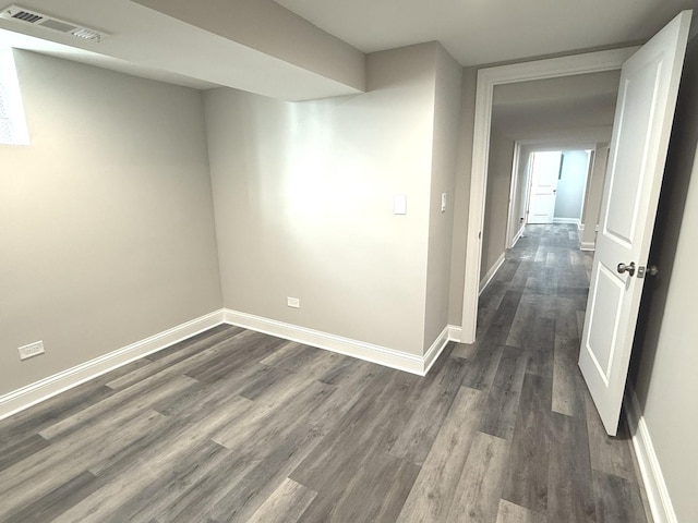 hallway with dark hardwood / wood-style floors