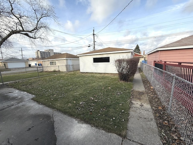 exterior space featuring an outbuilding and a front yard