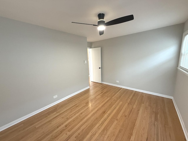 spare room featuring ceiling fan and light hardwood / wood-style flooring