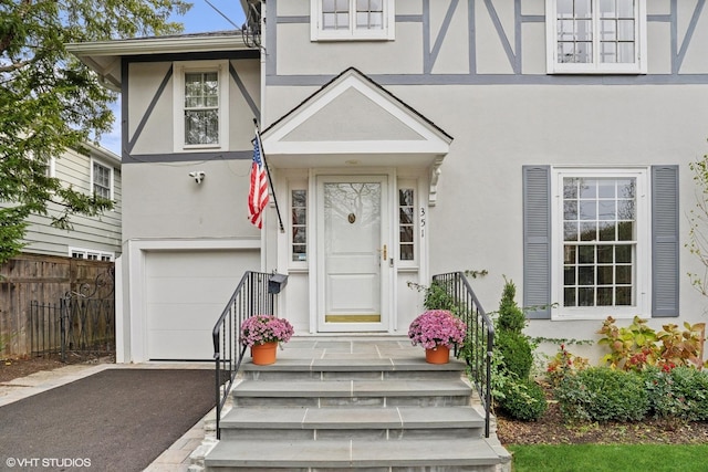 view of exterior entry featuring a garage