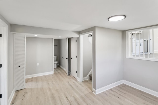 basement featuring light hardwood / wood-style flooring